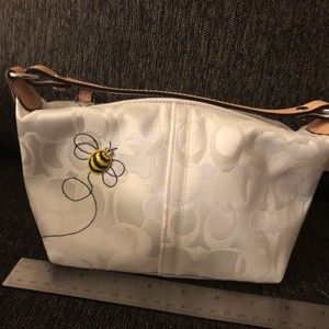 Coach purse with bumblebee